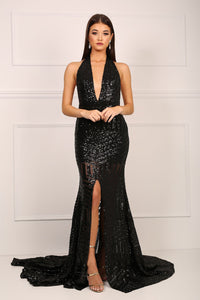 Front of black sequinned mermaid evening gown with halter v plunge neck and high centre front leg slit