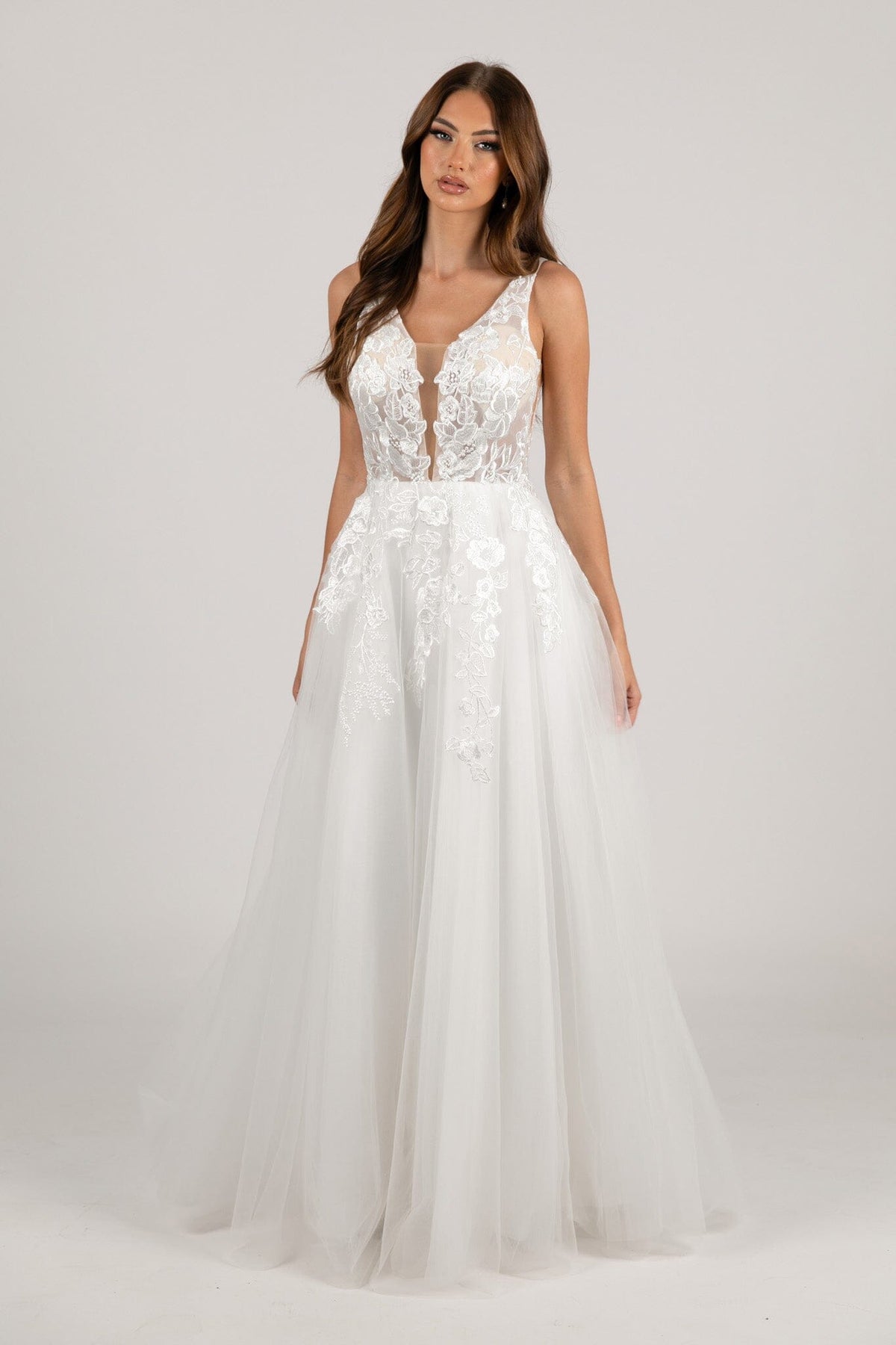 Ivory White A-line Wedding Gown with V Neckline adorned with Lace Appliques, Sheer Bodice and Full Voluminous Layered Tulle Skirt