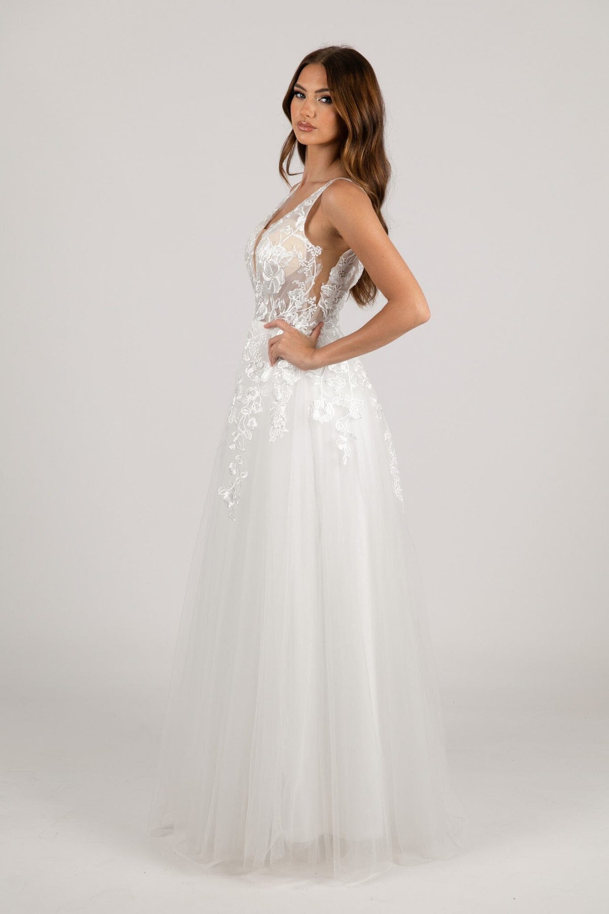 Side Sheer Mesh of Ivory White A-line Wedding Gown with V Neckline adorned with Lace Appliques, Sheer Bodice and Full Voluminous Layered Tulle Skirt