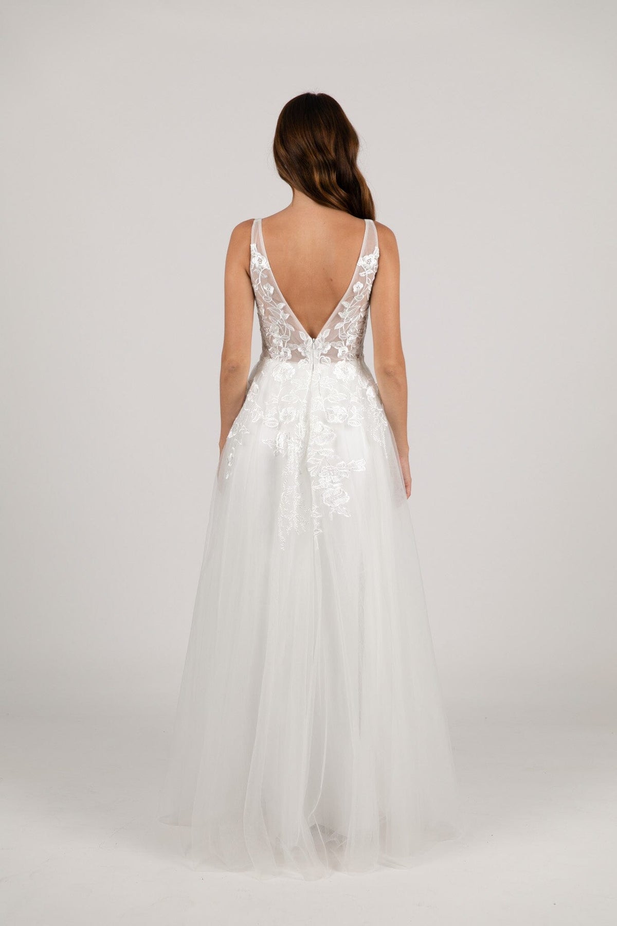 V Open Back Design of Ivory White A-line Wedding Gown with V Neckline adorned with Lace Appliques, Sheer Bodice and Full Voluminous Layered Tulle Skirt