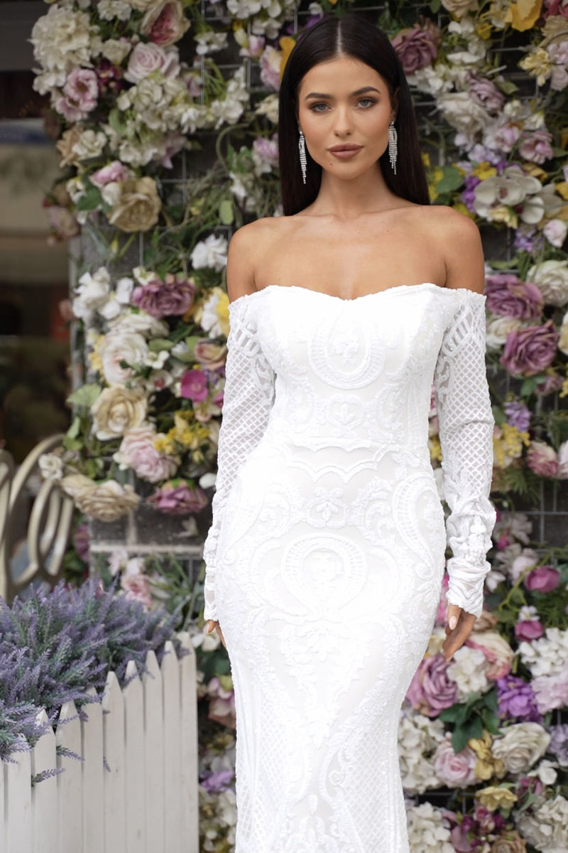 Close Up Image of White Off-The-Shoulder Long Sleeve Fitted Sequin Bridal Gown