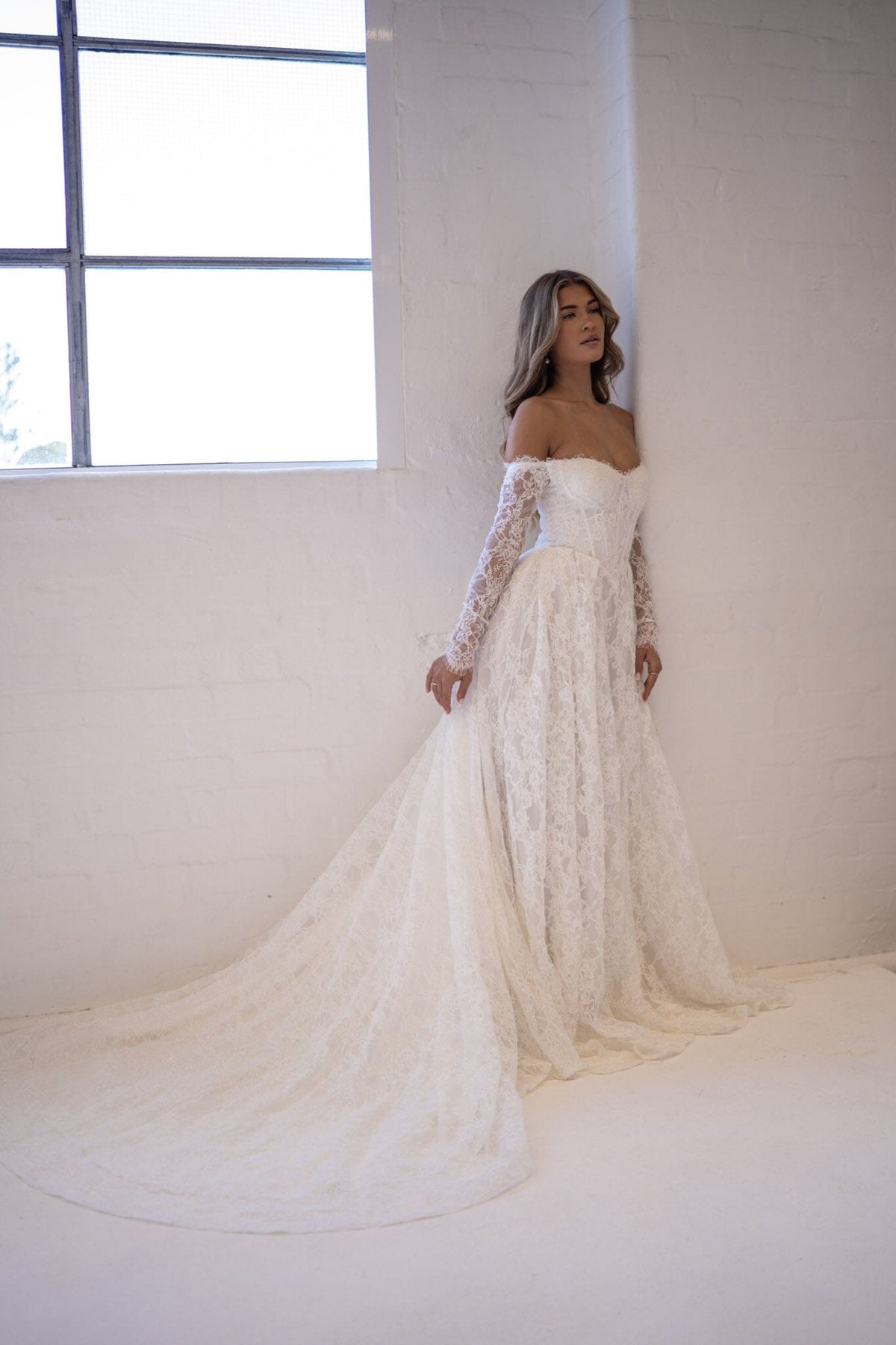 off shoulder lace wedding dress Monique Off-Shoulder Long Sleeve A-line Lace Gown