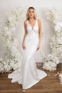 Form Fitting Ivory White Wedding Gown with V Neck, Lace Motif Detailing, Open Back and Sweep Train