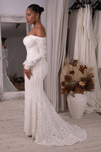 Side Image of White Off-The-Shoulder Long Sleeve Fitted Sequin Gown with Sheer Sleeves and Sweep Train