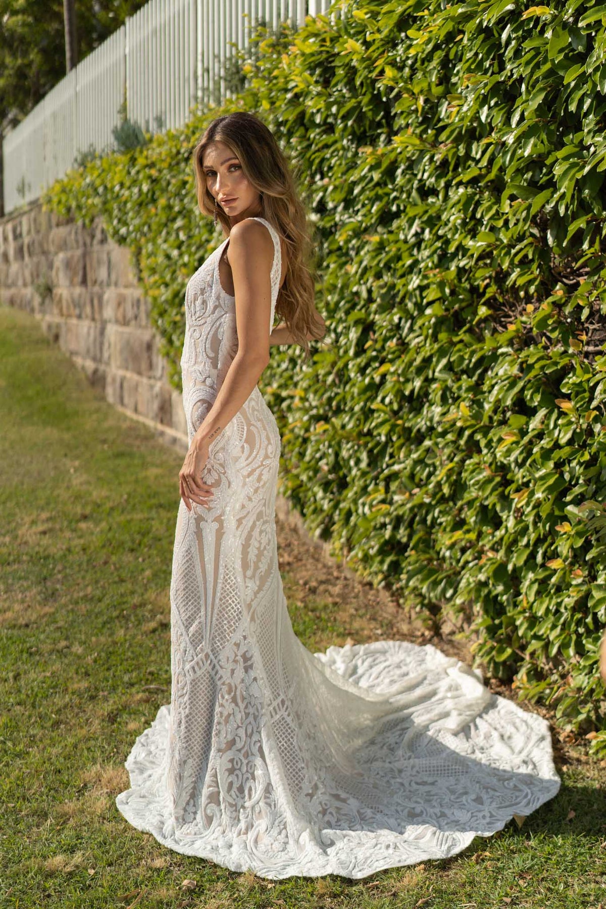 Side Image of White Embroidered Pattern Sequin with Nude Lining Floor Length Sleeveless Evening Dress with V-Neckline and Mermaid Skirt