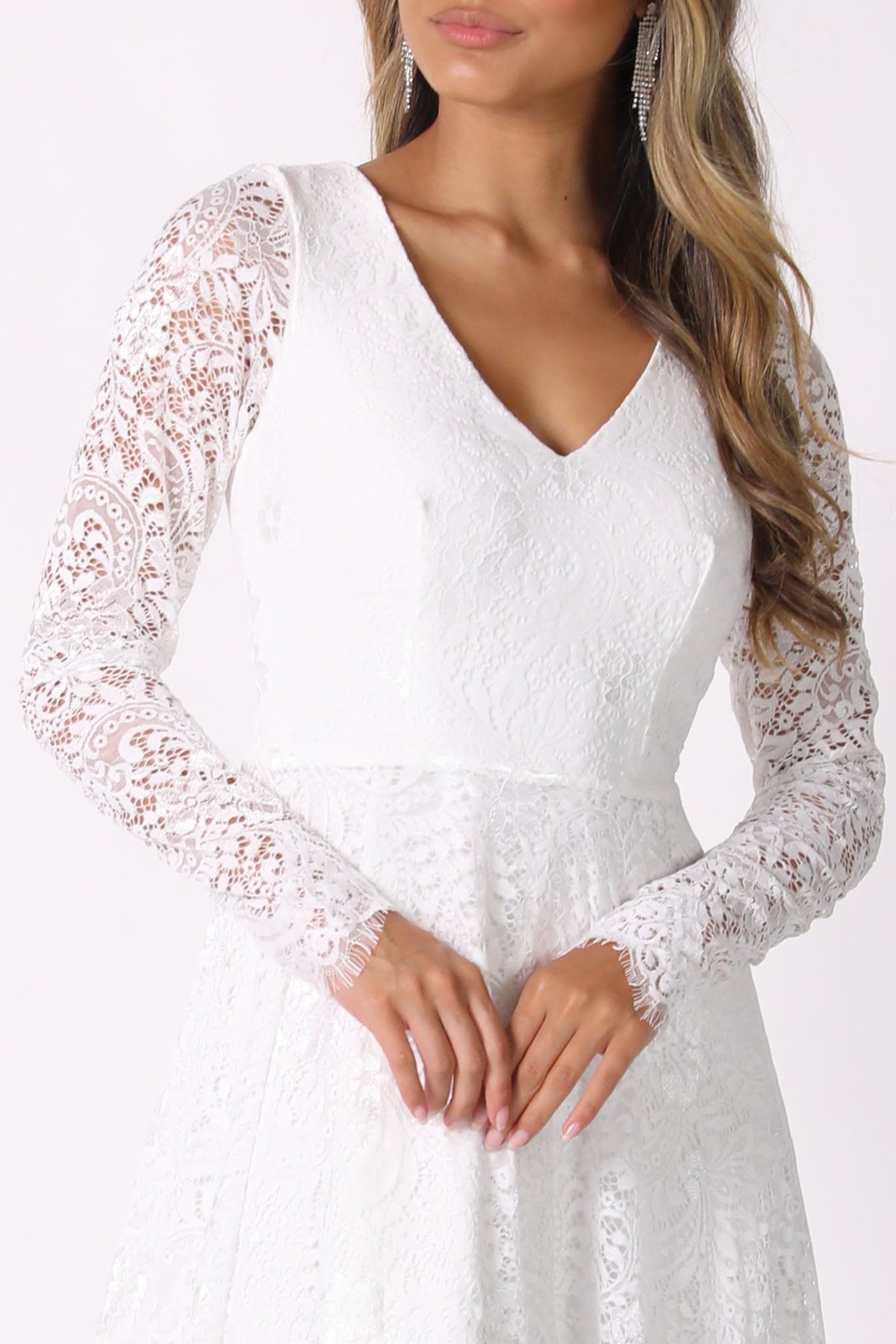 Close Up Image of Sheer 3 Dimensional Lace Sleeves of White Long Sleeve Lace Wedding Gown with V-Neck, Sheer Lace Fitted Sleeves, A-Line Skirt and Sweep Train